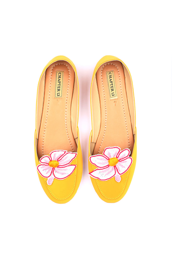 Yellow color khussa style loafer with a applique flower on top